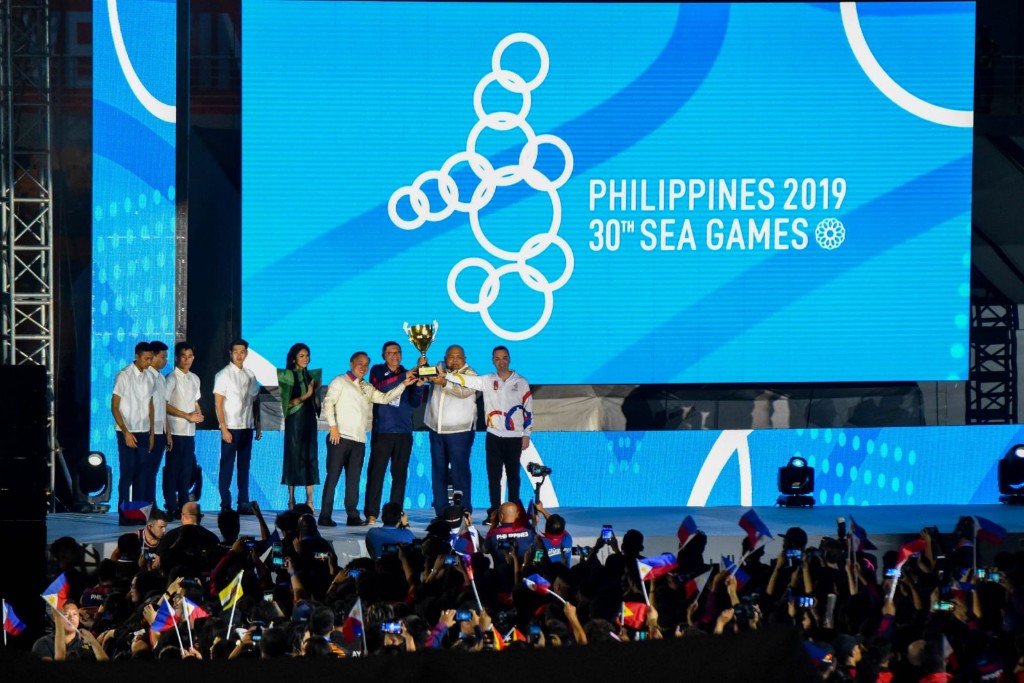 30th SEA Games countdown ceremony with officials on stage and the Philippines 2019 logo on screen